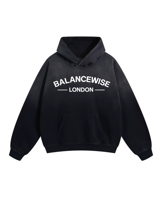 Black hoodie with 'Balancewise London' text on a white background