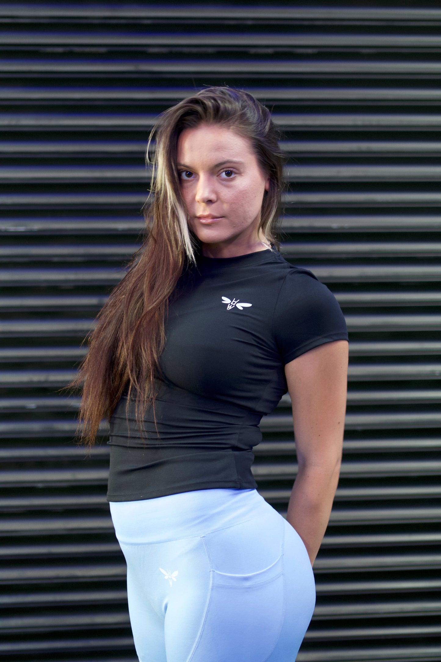 Woman lunging in a Balance Black Balancewise crewneck workout tee