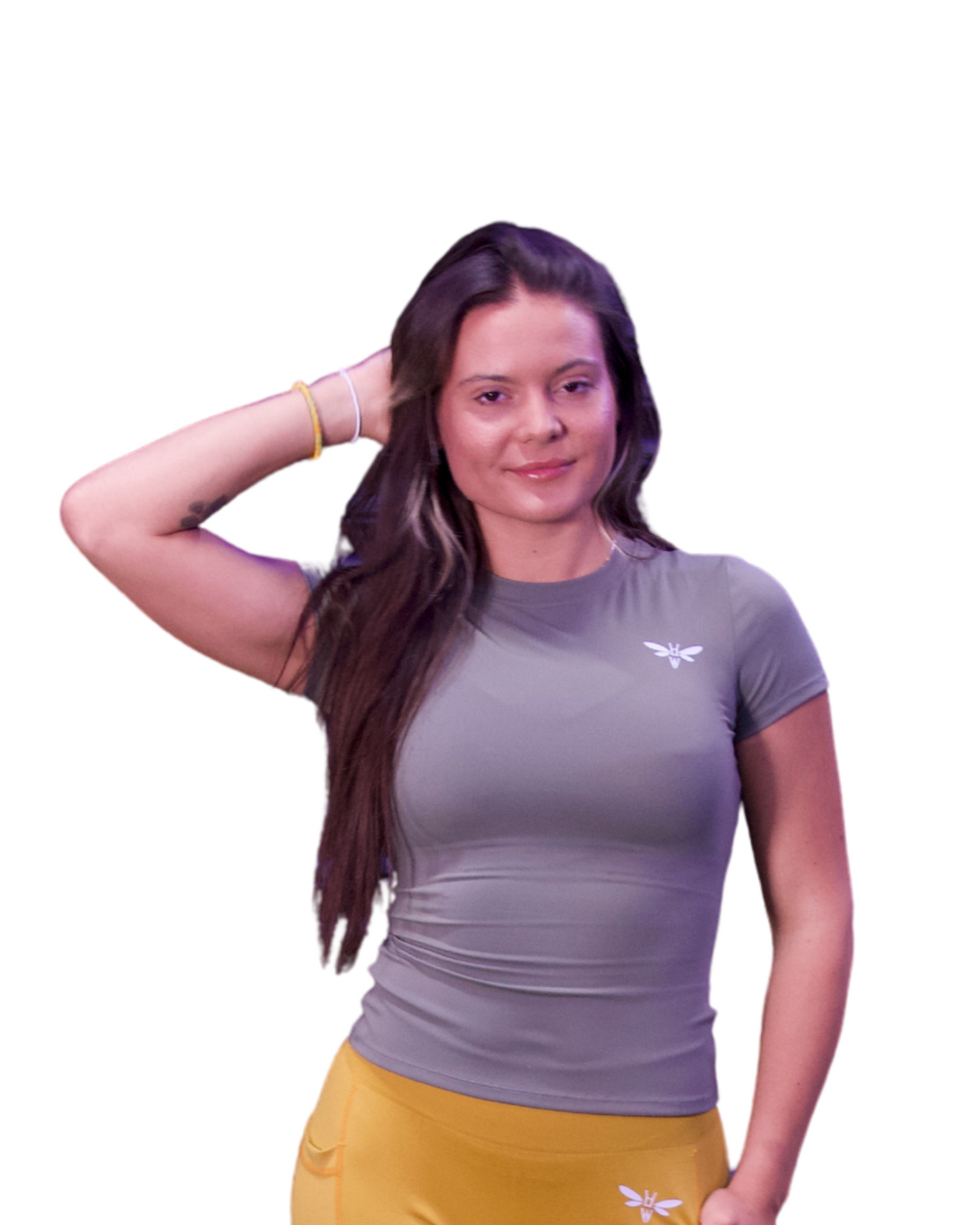 Woman wearing a Zen Grey Balancewise compression tee, arm raised during gym workout