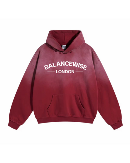 Red hoodie with 'Balancewise London' text on a white background front